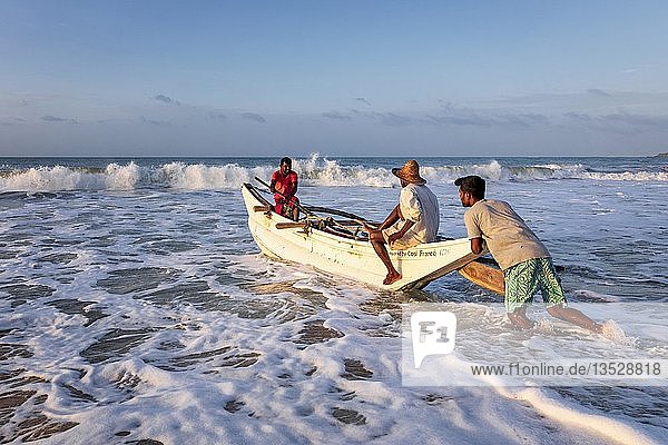 Fishermen in the boat in the surf  Sri Lanka  Asia