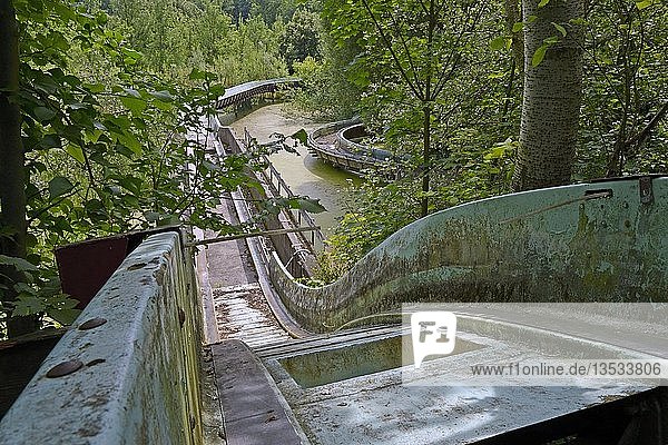 Morbid charm of the abandoned white-water ride in the former Spreepark Berlin amusement park  formerly known as Kulturpark Plaenterwald in the German Democratic Republic  Germany  Europe
