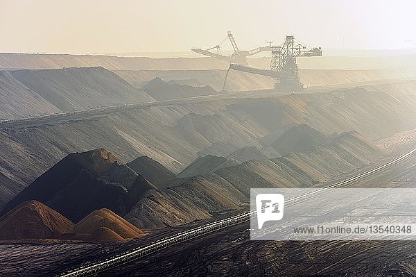 Two spreaders at the Garzweiler open-cast mine filling the pit Grevenbroich North Rhine-Westphalia Germany Europe