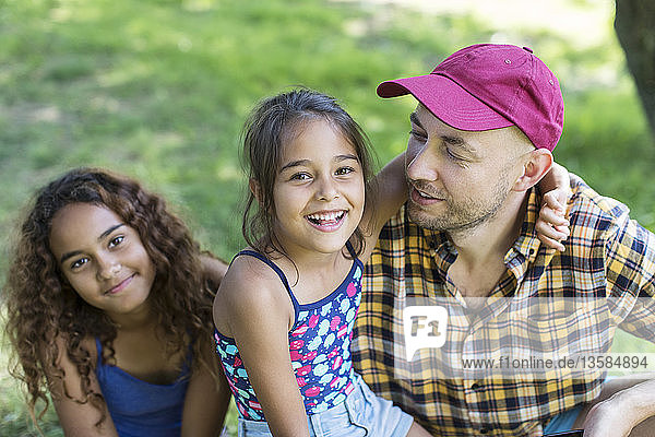 Portrait happy father and daughters