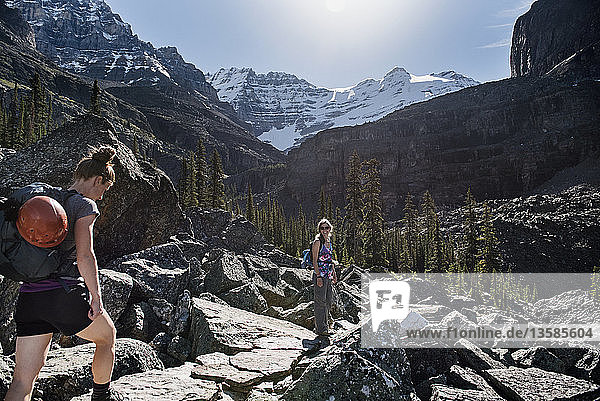 Women hiking in majestic  craggy mountain landscape  Yoho Park  British Columbia  Canada