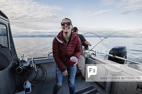 Portrait enthusiastic woman on fishing boat