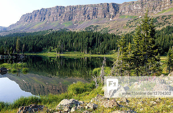 Flat Tops Wilderness Area,  Routt National Forest,  Colorado. The Chinese Wall reflected in a lake.