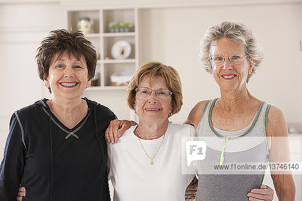 Portrait of three senior friends smiling