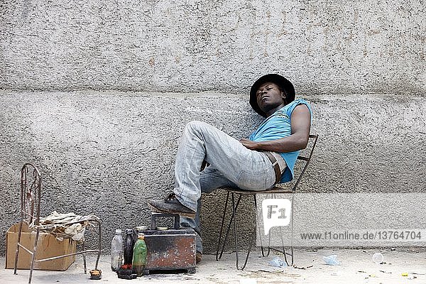 Life in Port au Prince after the 2010 quake  Shoeshine boy  Port-Au-Prince  Haiti.