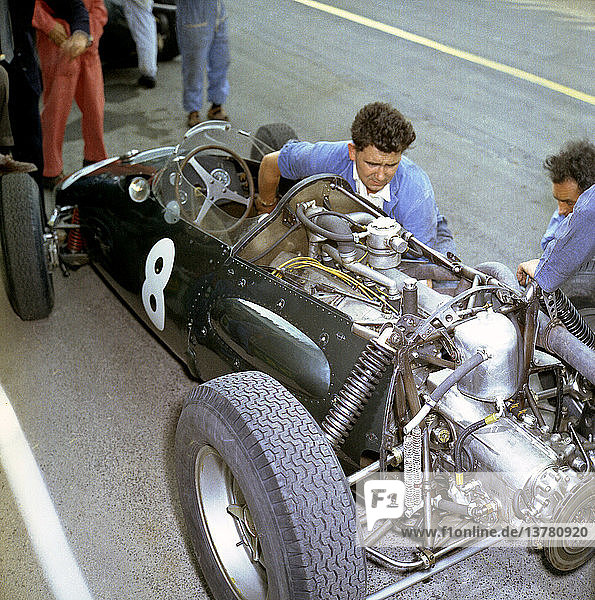 Chief Mechanic Phil Ayliffe working on the works BRM P48 2.5-litre F1 car driven by Bonnier. The pits at Reims  French GP  France 3 July 1960.