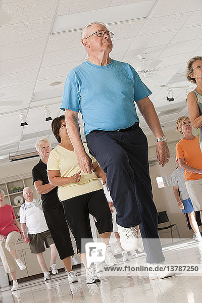 Seniors exercising in a health club