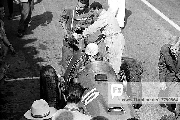 'Mechanic Emer Vecchi refueling Villoresi´s Ferrari in the French Grand Prix  Reims  France 1951. '