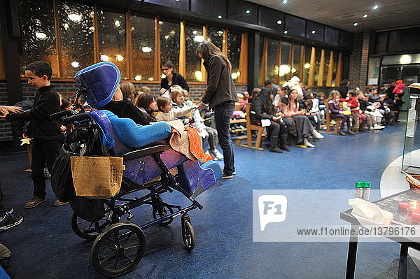 Christmas celebration in a catholic church. Disabled persons