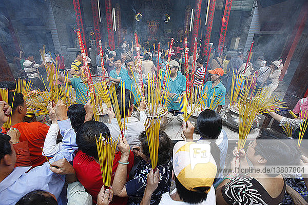 Thien Hau Temple. Burning Incense during Tet  the Vietnamese lunar New Year celebration.