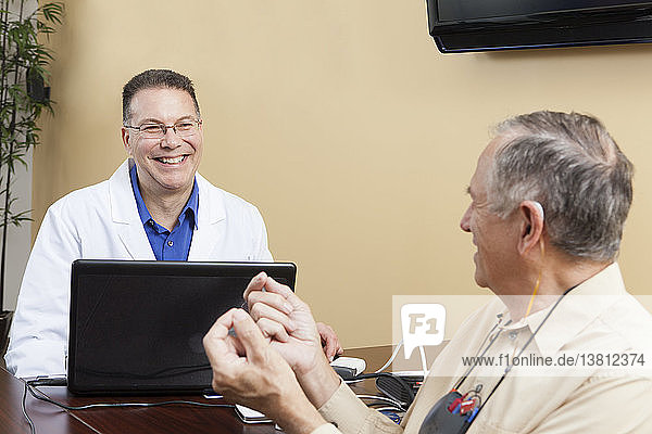 Patient providing feedback to an audiologist for hearing aid programming