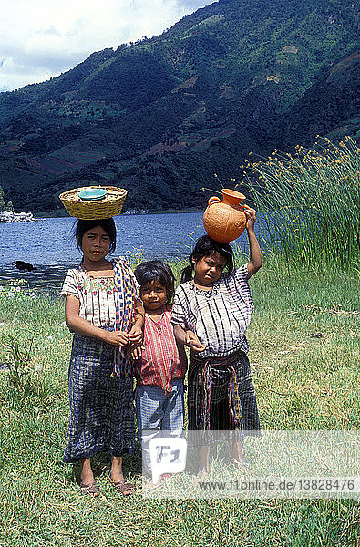 Three young girls Lake Atitlan  Guatemala  Central America