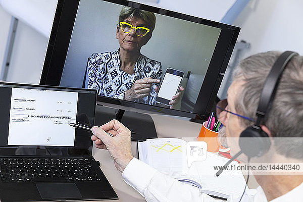Video consultation between a doctor and patient who wishes to have her medical tests explained.