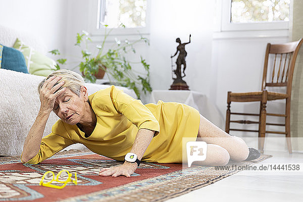 An elderly woman on her floor having fallen.
