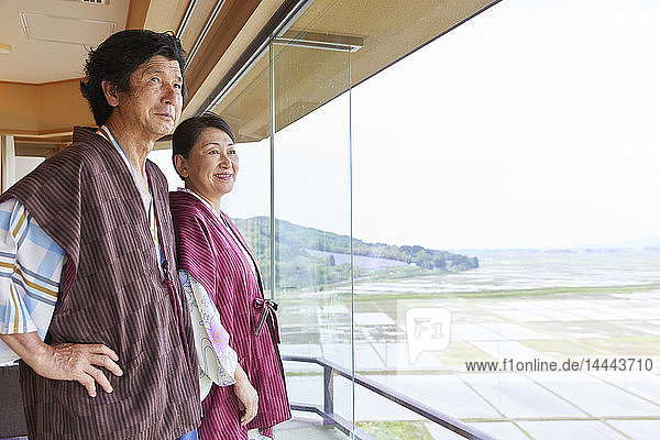 Japanese senior couple wearing yukata at a traditional hotel