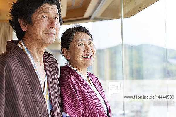 Japanese senior couple wearing yukata at a traditional hotel