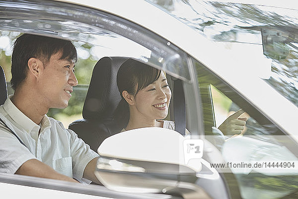 Japanese couple in the car