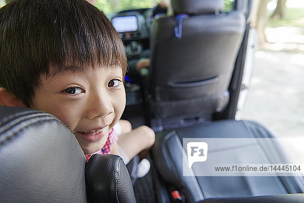 Japanese kid in the car