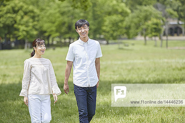 Japanese couple in a city park
