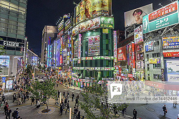 Street view with illuminated advertising boards at night  Shinjuku  Tokyo  Japan.
