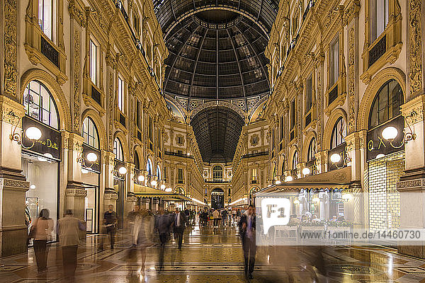 View of the interior of Galleria Vittorio Emanuele II illuminated at dusk  Milan  Lombardy  Italy