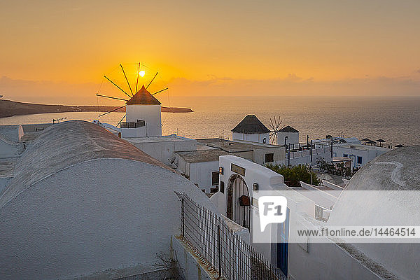 View of windmills at sunset in Oia village Santorini Cyclades Aegean Islands Greek Islands Greece Europe