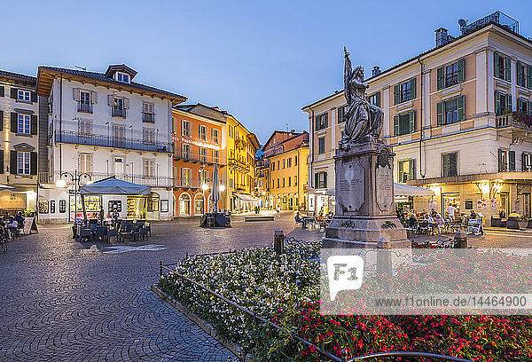 Al Fresco restaurants in Piazza Daniele Ranzoni at dusk Intra Verbania Province of Verbano-Cusio-Ossola Lake Maggiore Italian Lakes Italy
