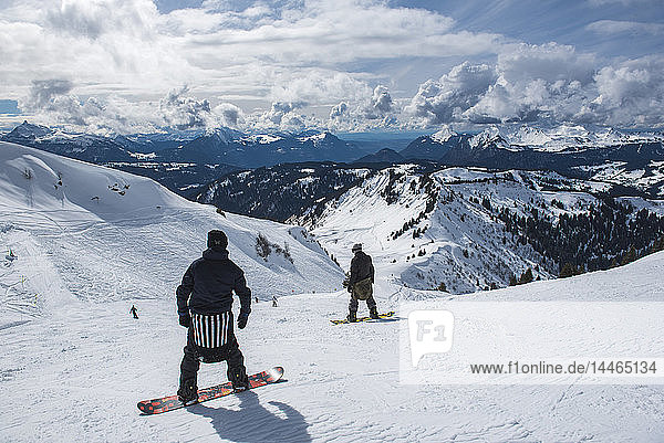 Snowboarders in the Morzine Ski Area  Port du Soleil  Auvergne Rhone Alpes  French Alps  France
