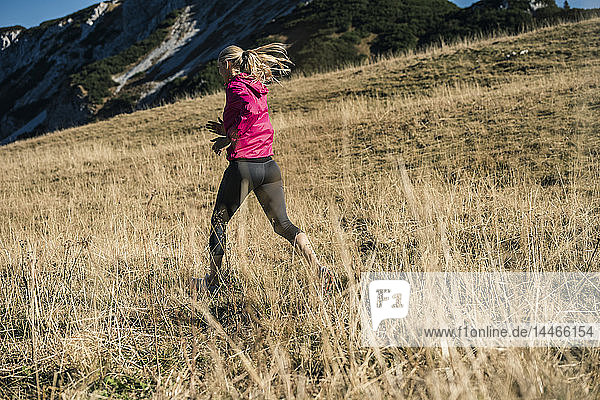 Austria  Tyrol  woman running in the mountains