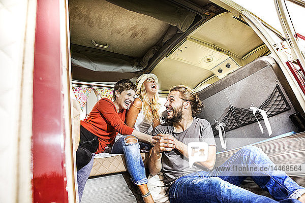 Carefree friends inside a van