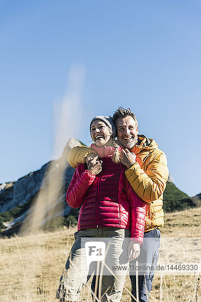 Austria  Tyrol  happy couple embracing on a hiking trip in the mountains