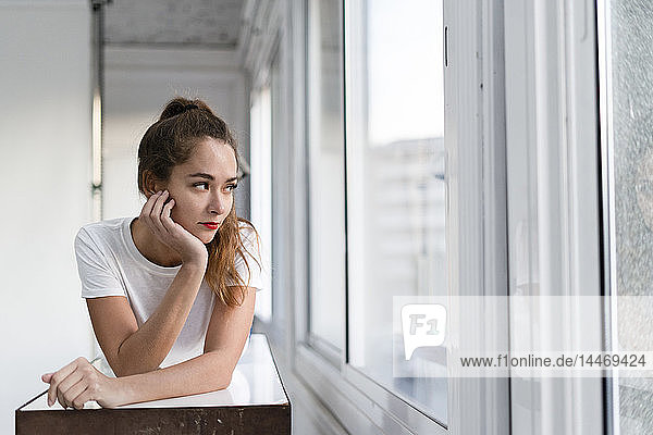 Portrait of a sexy aoung woman lying on a bench