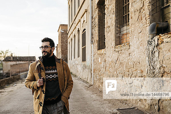 Spain Igualada man walking through the industrial zone of the town
