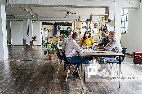 Business team having a meeting in loft office