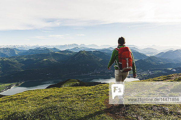 Austria  Salzkammergut  Hiker with backpack hiking in the Alps