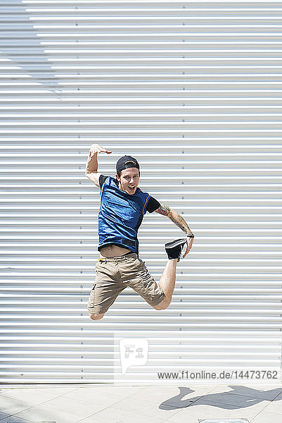 Young man jumping in the air