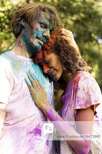 Affectionate couple celebrating Holi  Festival of Colors