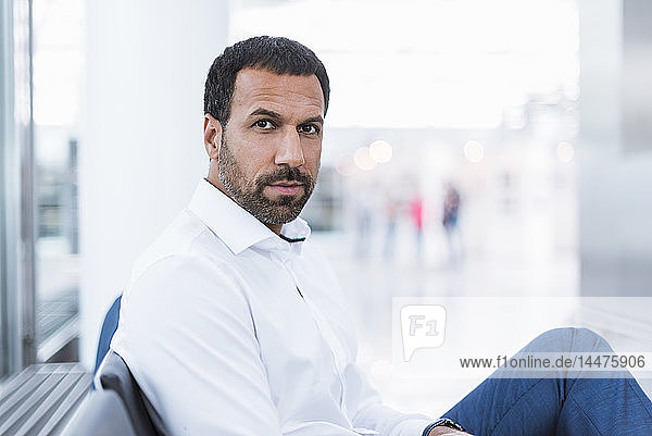 Portrait of businessman waiting in waiting hall