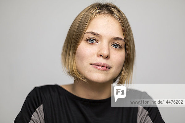 Portrait of blond young woman with bob hairdo