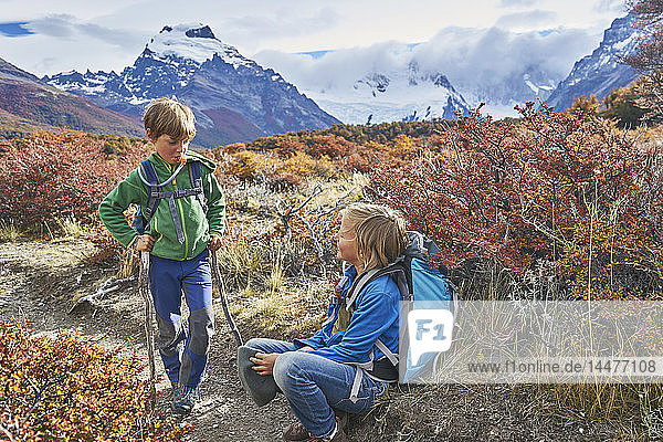 Argentina  Patagonia  El Chalten  two boys having a break from hiking in Los Glaciares National park