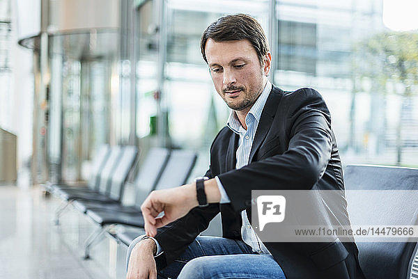 Businessman sitting at the airport  waiting