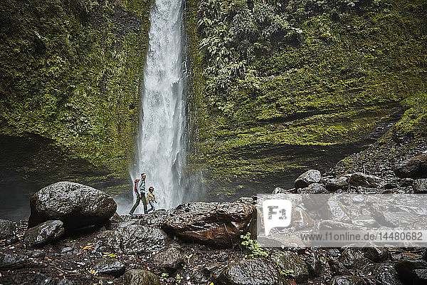 Chile  Patagonia  Osorno Volcano  mother and son walking at Las Cascadas waterfall