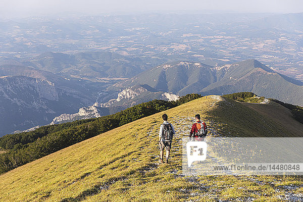 Italy  Monte Nerone  two men hiking on top of a mountain in summer