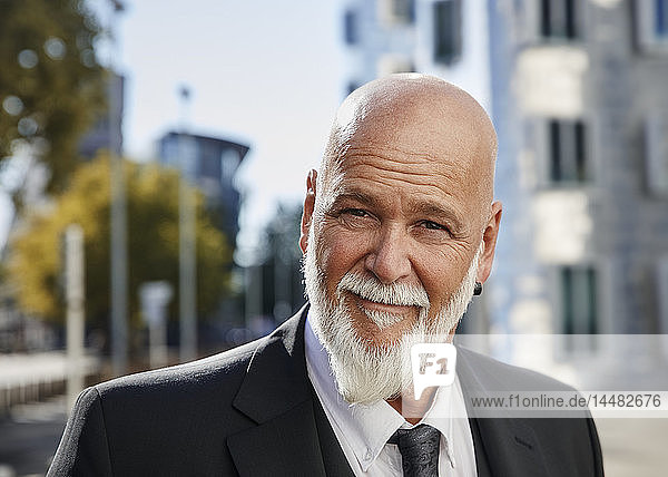 Portrait of an elegant businessman in the city