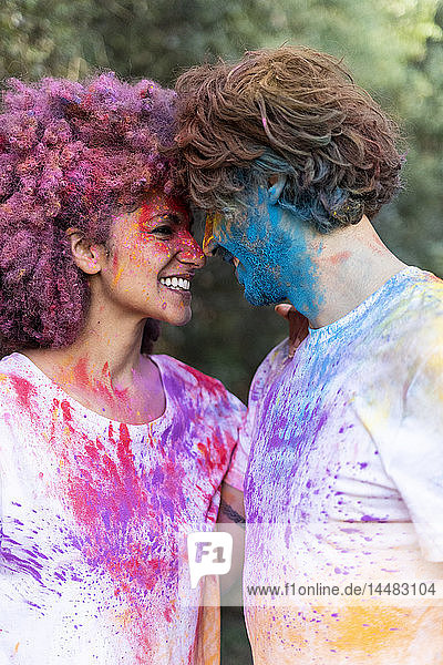 Couple full of colorful powder paint  celebrating Holi  Festival of Colors