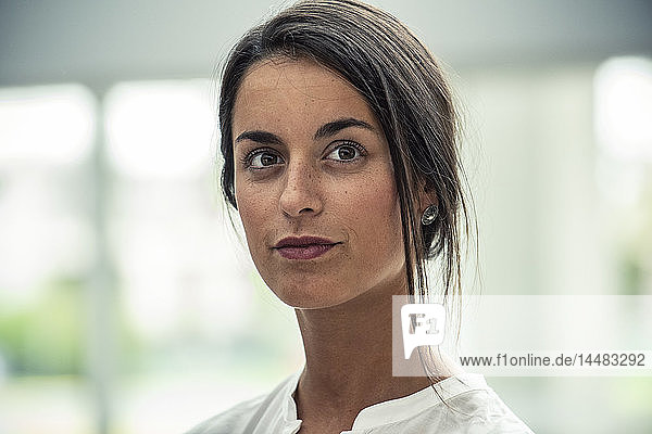 Close-up of businesswoman standing in hotel lobby