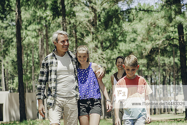 Family walking in forest