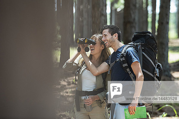 Young couple hiking in forest