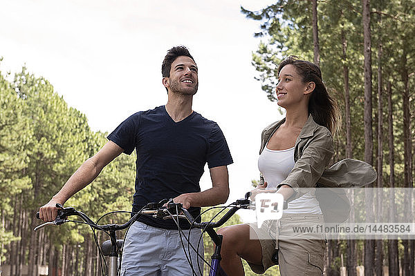 Young couple resting on bicycles
