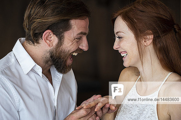 Close-up of man proposing to his girlfriend with a ring